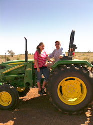 ric and girl on a tractor